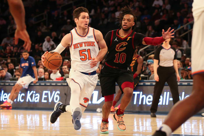 New York Knicks guard Ryan Arcidiacono drives past Cleveland Cavaliers guard Darius Garland